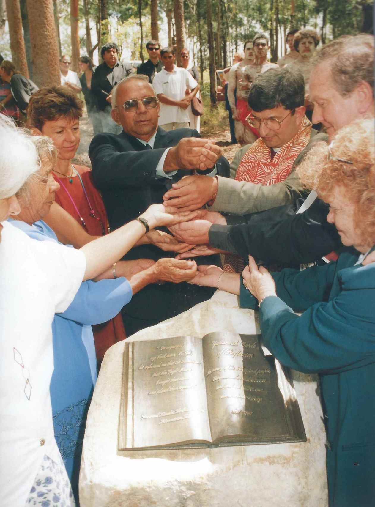 Uncle Bob Smith with elders and clergy mingles the soils