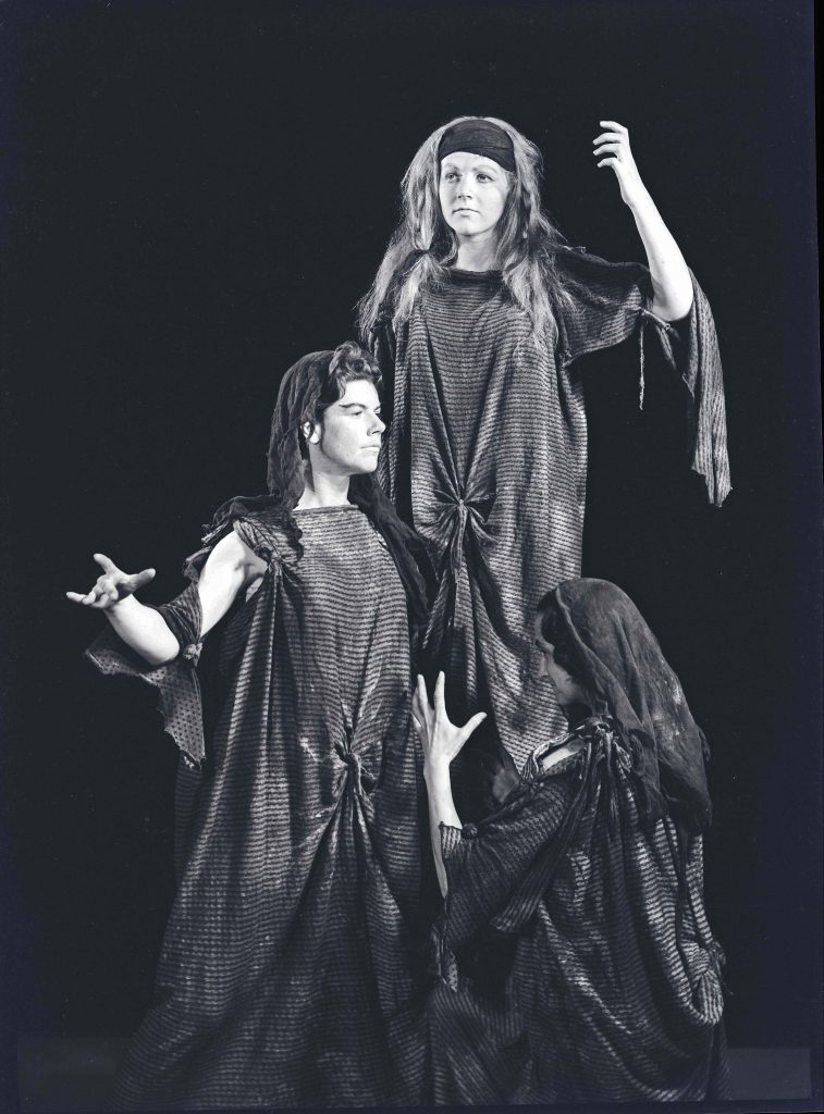Three women in theatrical settingMacbeth performance L to R 3 witches: Janet Combridge, Helen Tripp, Wendy Doyle (?) – Joyce Williams standing in for the photo op. [AHAN00473]
