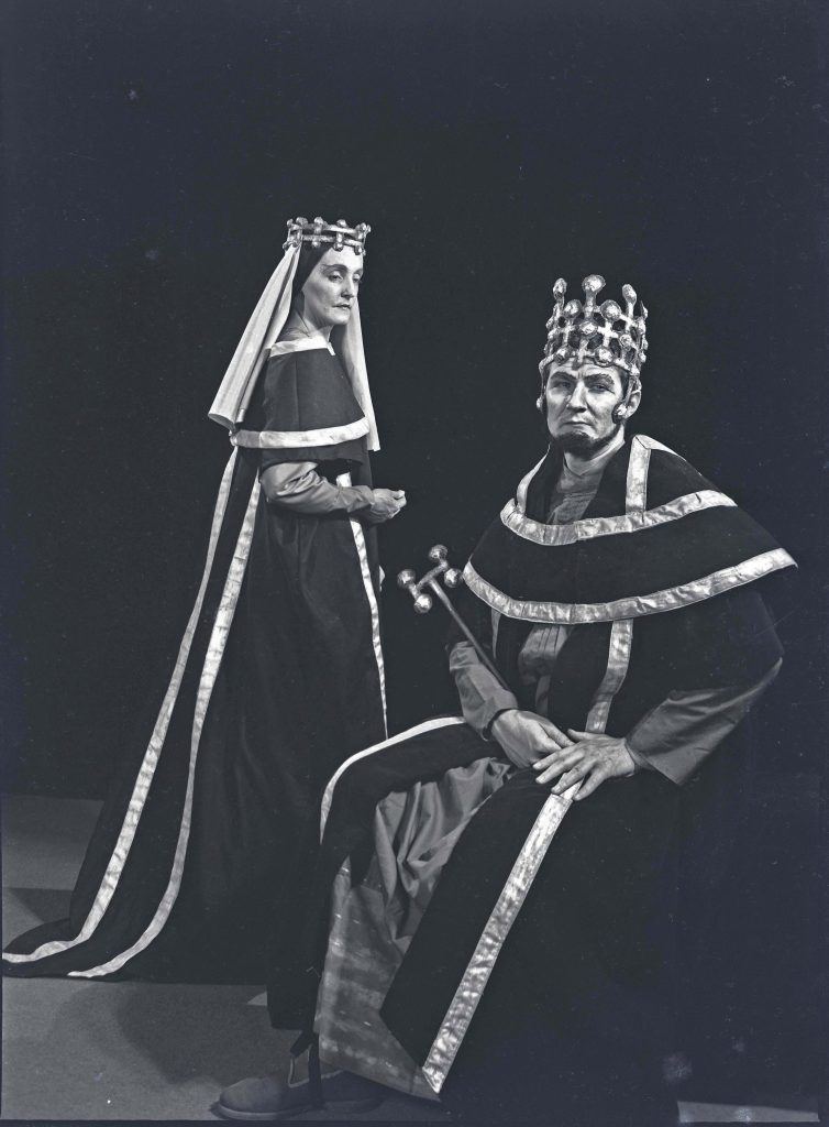 Man and women in theatrical setting. Joyce Williams as Lady Macbeth and John Stowell as Macbeth wearing crowns. June/July, 196. Hannan Photographic Archive [AHAN00475]