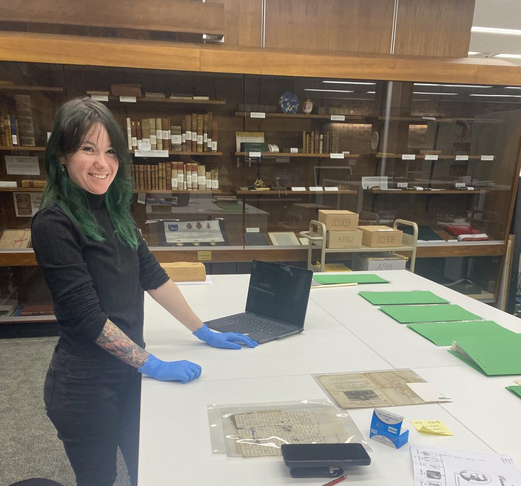 Erica Wright (Vera Deacon Intern) in Special Collections rehousing archival letters (May 2025)