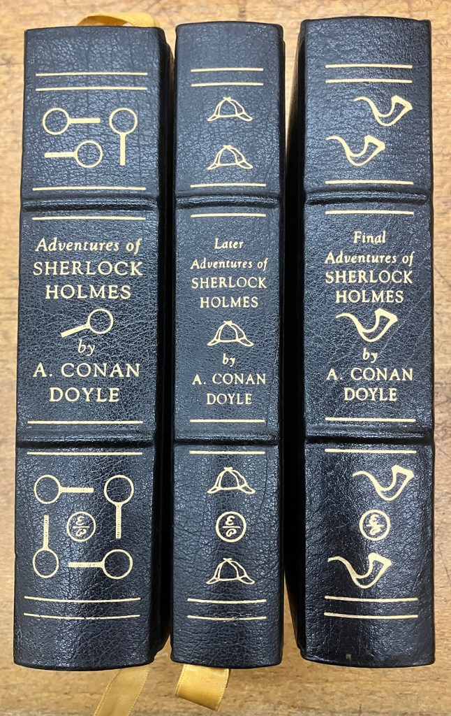 Three volumes of Sir Arthur Conan Doyle Sherlock Holmes stories donatd by Dr Lionel Fredman in August 2003.